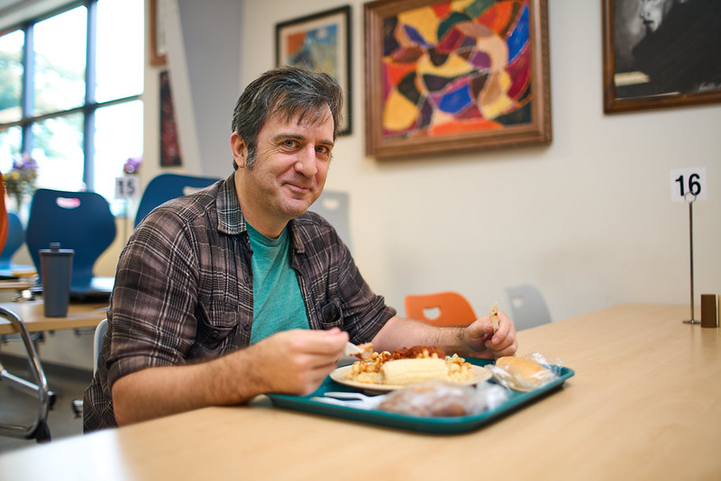 A man enjoys a hot meal at TASK